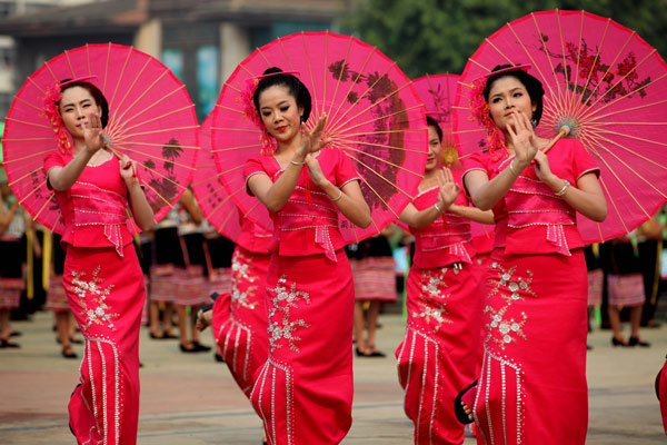 Performers dance at the Water Splashing Festival in Jinghong, April 15, 2013