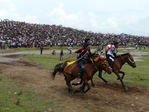 Horse Racing during Torch Festival near Xichang,Sichuan